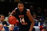 NEW YORK - MARCH 13:  Darris Nichols #14 of the West Virginia Mountaineers handles the ball against the Connecticut Huskies during day two of the 2008 Big East Men's Basketball Championship at Madison Square Garden on March 13, 2008 in New York City.  (Photo by Jim McIsaac/Getty Images)
