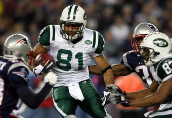 FOXBORO, MA - NOVEMBER 13:  Dustin Keller #81 of the New York Jets weaves past Jason Webster #23 of the New England Patriots on November 13, 2008 at Gillette Stadium in Foxboro, Massachusetts.  (Photo by Elsa/Getty Images)