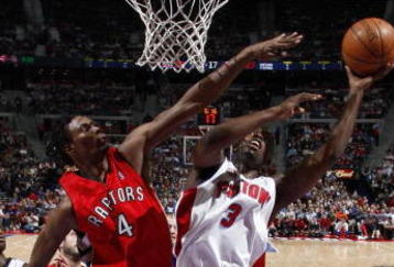 AUBURN HILLS, MI - JANUARY 15:  Rodney Stuckey #3 of the Detroit Pistons tries to get a shot off around Chris Bosh #4 of the Toronto Raptors on January 15, 2008 at the Palace of Auburn Hills in Auburn Hills, Michigan. Detroit won the game 103-89. NOTE TO USER: User expressly acknowledges and agrees that, by downloading and or using this photograph, User is consenting to the terms and conditions of the Getty Images License Agreement.  (Photo by Gregory Shamus/Getty Images)