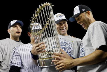 NEW YORK - NOVEMBER 04:  (L-R) Andy Pettitte #46, Jorge Posada #20, Derek Jeter #2 and Mariano Rivera #42 of the New York Yankees celebrate with the trophy after their 7-3 win against the Philadelphia Phillies in Game Six of the 2009 MLB World Series at Yankee Stadium on November 4, 2009 in the Bronx borough of New York City.  (Photo by Pool/Getty Images)