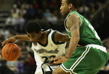 LONDON - OCTOBER 10:  Corey Brewer #22 of Minnesota is challenged by Dahntay Jones of Boston during NBA Europe Live 2007 Tour match between the Boston Celtics and the Minnesota Timberwolves at the O2 Arena on October 10, 2007 in London, England.  NOTE TO USER: User expressly acknowledges and agrees that, by downloading and or using this Photograph, user is consenting to the terms and conditions of the Getty Images License Agreement.  (Photo by John Gichigi/Getty Images)