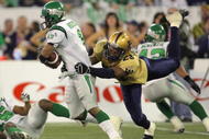 TORONTO - NOVEMBER 25:  O'Neil Wilson #1 of the Saskatchewan Rough Riders breaks away from the tackle of Kyries Hebert #23 of the Winnipeg Blue Bombers during the third quarter in the 95th Grey Cup on November 25, 2007 at the Rogers Centre in Toronto, Ontario, Canada.  The Rough Riders won 23-19.  (Photo by Harry How/Getty Images)