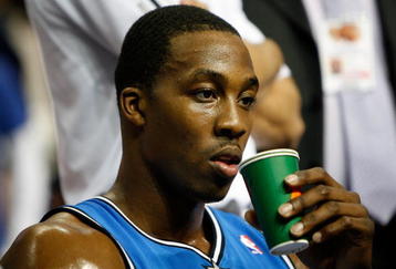 AUBURN HILLS, MI - MAY 13:  Dwight Howard #12 of the Orlando Magic takes a drink on the bench against the Detroit Pistons in Game Five of the Eastern Conference Semifinals during the 2008 NBA Playoffs at the Palace of Auburn Hills in Auburn Hills, Michigan.  NOTE TO USER: User expressly acknowledges and agrees that, by downloading and or using this photograph, User is consenting to the terms and conditions of the Getty Images License Agreement.  (Photo by Gregory Shamus/Getty Images)