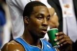 AUBURN HILLS, MI - MAY 13:  Dwight Howard #12 of the Orlando Magic takes a drink on the bench against the Detroit Pistons in Game Five of the Eastern Conference Semifinals during the 2008 NBA Playoffs at the Palace of Auburn Hills in Auburn Hills, Michigan.  NOTE TO USER: User expressly acknowledges and agrees that, by downloading and or using this photograph, User is consenting to the terms and conditions of the Getty Images License Agreement.  (Photo by Gregory Shamus/Getty Images)