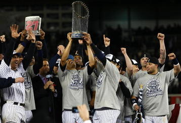 NEW YORK - NOVEMBER 04:  Mariano Rivera #42 of the New York Yankees holds up the trophy as he celebrates with his teammates after their 7-3 win against the Philadelphia Phillies in Game Six of the 2009 MLB World Series at Yankee Stadium on November 4, 2009 in the Bronx borough of New York City.  (Photo by Chris McGrath/Getty Images)