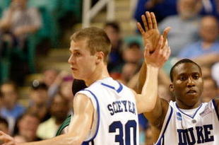 GREENSBORO, NC - MARCH 19: Nolan Smith #2 of the Duke Blue Devils celebrates a basket with Jon Scheyer #30 and David McClure #14 against the Binghamton Bearcats during the first round of the NCAA Division I Men's Basketball Tournament at the Greensboro Coliseum on March 19, 2009 in Greensboro, North Carolina. (Photo by Streeter Lecka/Getty Images)