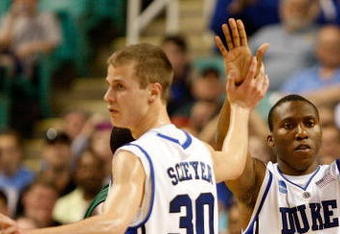 GREENSBORO, NC - MARCH 19:  Nolan Smith #2 of the Duke Blue Devils celebrates a basket with Jon Scheyer #30 and David McClure #14 against the Binghamton Bearcats during the first round of the NCAA Division I Men's Basketball Tournament at the Greensboro Coliseum on March 19, 2009 in Greensboro, North Carolina.  (Photo by Streeter Lecka/Getty Images)