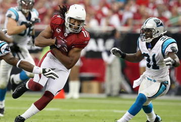 GLENDALE, AZ - NOVEMBER 01:  Wide receiver Larry Fitzgerald #11 of the Arizona Cardinals runs with the ball after a reception during the NFL game against the Carolina Panthers at the Universtity of Phoenix Stadium on November 1, 2009 in Glendale, Arizona. The Panthers defeated the Cardinals 34-21.  (Photo by Christian Petersen/Getty Images)