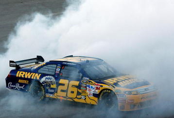 TALLADEGA, AL - NOVEMBER 01:  Jamie McMurray, driver of the #26 IRWIN Marathon Ford, does a burnout after winning the NASCAR Sprint Cup Series AMP Energy 500 at Talladega Superspeedway on November 1, 2009 in Talladega, Alabama.  (Photo by Chris Graythen/Getty Images)