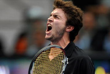 VALENCIA, SPAIN - NOVEMBER 04:  Gilles Simon of France celebrates his win in his second round match against Tomas Berdych of the Czech Republic during the ATP 500 World Tour Valencia Open tennis tournament at the Ciudad de las Artes y las Ciencias on November 4, 2009 in Valencia, Spain. Simon won the match in three sets, 6-4, 4-6 and 6-3.  (Photo by Jasper Juinen/Getty Images)