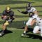 BOULDER, CO - OCTOBER 31: Scotty McKnight #21 of the Colorado Buffaloes makes a reception and tries to avoid the defense of Will Ebner #32 and Andrew Gachkar #6 of of the Missouri Tigers at Folsom Field on October 31, 2009 in Boulder, Colorado. Missouri defeated Colorado 36-17. (Photo by Doug Pensinger/Getty Images)
