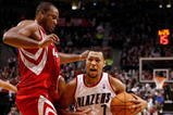 PORTLAND, OR - OCTOBER 27:  Brandon Roy #7 of the Portland Trail Blazers drives against Chuck Hayes #44 of the Houston Rockets during the season opener on October 27, 2009 at the Rose Garden in Portland, Oregon. NOTE TO USER: User expressly acknowledges and agrees that, by downloading and or using this Photograph, user is consenting to the terms and conditions of the Getty Images License Agreement.  (Photo by Jonathan Ferrey/Getty Images)