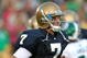 SOUTH BEND, IN - SETPEMBER 19: Jimmy Clausen #7 of the Notre Dame Fighting Irish smiles as he leaves the field after a win over the Michigan State Spartans on September 19, 2009 at Notre Dame Stadium in South Bend, Indiana. Notre Dame defeated Michigan State 33-30. (Photo by Jonathan Daniel/Getty Images)