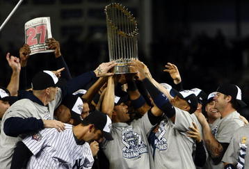 NEW YORK - NOVEMBER 04:  The New York Yankees celebrate with the trophy after their 7-3 win against the Philadelphia Phillies in Game Six of the 2009 MLB World Series at Yankee Stadium on November 4, 2009 in the Bronx borough of New York City.  (Photo by Chris McGrath/Getty Images)