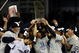NEW YORK - NOVEMBER 04:  The New York Yankees celebrate with the trophy after their 7-3 win against the Philadelphia Phillies in Game Six of the 2009 MLB World Series at Yankee Stadium on November 4, 2009 in the Bronx borough of New York City.  (Photo by Chris McGrath/Getty Images)