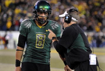 EUGENE, OR - OCTOBER 31: Quarterback Jeremiah Masoli #8 and speaks with head coach Chip Kelly of the Oregon Ducks during a timeout in the third quarter of the game against the USC Trojans at Autzen Stadium on October 31, 2009 in Eugene, Oregon. Masoli threw for 222 yards and a touchdown and ran for 164 more yards with another score as Oregon defeated USC 47-20. (Photo by Steve Dykes/Getty Images)