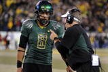 EUGENE, OR - OCTOBER 31: Quarterback Jeremiah Masoli #8 and speaks with head coach Chip Kelly of the Oregon Ducks during a timeout in the third quarter of the game against the USC Trojans at Autzen Stadium on October 31, 2009 in Eugene, Oregon. Masoli threw for 222 yards and a touchdown and ran for 164 more yards with another score as Oregon defeated USC 47-20. (Photo by Steve Dykes/Getty Images)