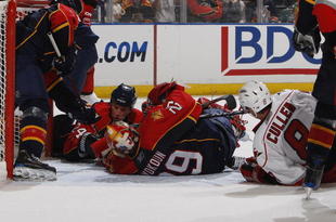SUNRISE, FL - NOVEMBER 4: Goaltender Tomas Vokoun #29 and Bryan McCabe #24 of the Florida Panthers go to the ice to block the shot by Matt Cullen #8 of the Carolina Hurricanes in the second period on November 4, 2009 at the BankAtlantic Center in Sunrise, Florida. (Photo by Joel Auerbach/Getty Images)