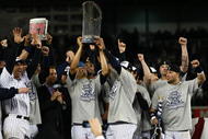 NEW YORK - NOVEMBER 04:  Mariano Rivera #42 of the New York Yankees holds up the trophy as he celebrates with his teammates after their 7-3 win against the Philadelphia Phillies in Game Six of the 2009 MLB World Series at Yankee Stadium on November 4, 2009 in the Bronx borough of New York City.  (Photo by Chris McGrath/Getty Images)