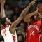 LOUISVILLE, KY - DECEMBER 27:  Earl Clark #5 of the Louisville Cardinals defends Bennet Davis #14 of the Northeastern Huskies on December 27, 2006 at Freedom Hall in Louisville, Kentucky.  (Photo by Andy Lyons/Getty Images)