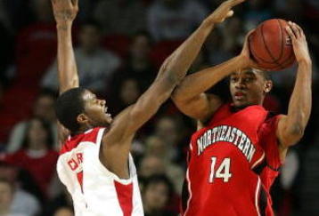 LOUISVILLE, KY - DECEMBER 27:  Earl Clark #5 of the Louisville Cardinals defends Bennet Davis #14 of the Northeastern Huskies on December 27, 2006 at Freedom Hall in Louisville, Kentucky.  (Photo by Andy Lyons/Getty Images)