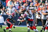 ORCHARD PARK, NY - OCTOBER 11: Jamal Lewis #31 of the Cleveland Browns tries to jump over Keith Ellison #56 of the Buffalo Bills at Ralph Wilson Stadium on October 11, 2009 in Orchard Park, New York.The Browns defeated the Bills 6-3. (Photo by Rick Stewart/Getty Images)