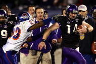 SAN DIEGO, CA - DECEMBER 23:  Quarterback Andy Dalton #14 of  TCU runs with the ball against the tackle of Safety Jeron Johnson #23 of Boise State during the San Diego County Credit Union Poinsettia Bowl at Qualcomm Stadium on December 23, 2008 in San Diego, California. (Photo by Donald Miralle/Getty Images)