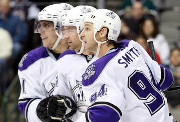 DALLAS - OCTOBER 19:  (L-R) Anze Kopitar #11, Justin Williams #14 and Ryan Smyth #94 of the Los Angeles Kings celebrate a goal against the Dallas Stars at American Airlines Center on October 19, 2009 in Dallas, Texas.  (Photo by Ronald Martinez/Getty Images)
