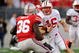 COLUMBUS, OH - OCTOBER 10: Quarterback Scott Tolzien #16 of the Wisconsin Badgers looks for running room as Brian Rolle #36 of the Ohio State Buckeyes closes in for the tackle at Ohio Stadium on October 10, 2009 in Columbus, Ohio. (Photo by Jamie Sabau/Getty Images)