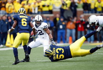 ANN ARBOR, MI - OCTOBER 24:  Evan Royster #22 of the Penn State Nittany Lions carries the ball against Donovan Warren #6 and Ryan Van Bergen #53 of the Michigan Wolverines on October 24, 2009 at Michigan Stadium in Ann Arbor, Michigan. (Photo by  Gregory Shamus/Getty Images)