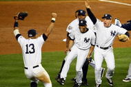NEW YORK - NOVEMBER 04:  Mariano Rivera #42 (C) and Mark Teixeira #25 (R) of the New York Yankees runs towards Alex Rodriguez #13 and his teammates as they celebrate after their 7-3 win against the Philadelphia Phillies in Game Six of the 2009 MLB World Series at Yankee Stadium on November 4, 2009 in the Bronx borough of New York City.  (Photo by Chris McGrath/Getty Images)