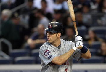 NEW YORK - OCTOBER 09:  Joe Mauer #7 of the Minnesota Twins bats against the New York Yankees in Game Two of the ALDS during the 2009 MLB Playoffs at Yankee Stadium on October 9, 2009 in the Bronx borough of New York City.  (Photo by Jim McIsaac/Getty Images)