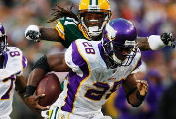 GREEN BAY, WI - NOVEMBER 01:  Al Harris #31 of the Green Bay Packers tackles Adrian Peterson #28 of the Minnesota Vikings during the third quarter of the game at Lambeau Field on November 1, 2009 in Green Bay, Wisconsin. (Photo by Scott Boehm/Getty Images)