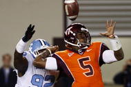 BLACKSBURG, VA - OCTOBER 29:  Quarterback Tyrod Taylor #5 of the Virginia Tech University Hokies is defended by E.J. Wilson #92 of the North Carolina Tar Heels during the  game at Lane Stadium on October 29, 2009 in Blacksburg, Virginia.  (Photo by Scott Halleran/Getty Images)