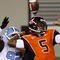 BLACKSBURG, VA - OCTOBER 29:  Quarterback Tyrod Taylor #5 of the Virginia Tech University Hokies is defended by E.J. Wilson #92 of the North Carolina Tar Heels during the  game at Lane Stadium on October 29, 2009 in Blacksburg, Virginia.  (Photo by Scott Halleran/Getty Images)