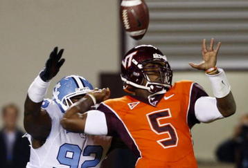 BLACKSBURG, VA - OCTOBER 29:  Quarterback Tyrod Taylor #5 of the Virginia Tech University Hokies is defended by E.J. Wilson #92 of the North Carolina Tar Heels during the  game at Lane Stadium on October 29, 2009 in Blacksburg, Virginia.  (Photo by Scott Halleran/Getty Images)
