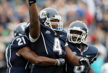 EAST HARTFORD, CT - SEPTEMBER 12:  Twyon Martin #4 of the Connecticut Huskies celebrates his fumble recovery with teammates Gary Wilburn #21 and Jasper Howard #6 in the second half against the North Carolinia Tar Heels on September 12, 2009 at Rentschler Field in East Hartford, Connecticut. The Tar Heels defeated the Huskies 12-10.  (Photo by Elsa/Getty Images)