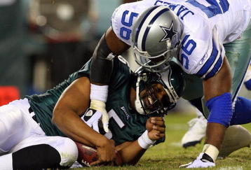 PHILADELPHIA - DECEMBER 28:  Bradie James #56 of the Dallas Cowboys sacks Donovan McNabb #5 of the Philadelphia Eagles on December 28, 2008 at Lincoln Financial Field in Philadelphia, Pennsylvania.  (Photo by Jim McIsaac/Getty Images)