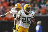 CLEVELAND, OH - OCTOBER 25:  Ryan Grant #25 of the Green Bay Packers runs by Kenyon Coleman #90 of the Cleveland Browns at Cleveland Browns Stadium on October 25, 2009 in Cleveland, Ohio.  (Photo by Matt Sullivan/Getty Images)