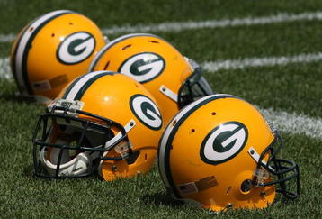 GREEN BAY, WI - AUGUST 03: Helmets sit on the field during the Green Bay Packers practice at summer training camp on August 3, 2009 at the Ray Nitschke Field in Green Bay, Wisconsin. (Photo by Jonathan Daniel/Getty Images)