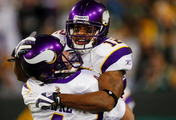 GREEN BAY, WI - NOVEMBER 01: Quarterback Brett Favre #4 of the Minnesota Vikings celebrates with teammate Percy Harvin #12 after a 51 yard touchdown pass during the third quarter of the game against the Green Bay Packers at Lambeau Field on November 1, 2009 in Green Bay, Wisconsin. (Photo by Scott Boehm/Getty Images)