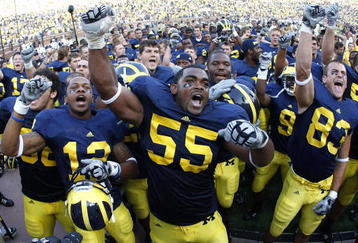 ANN ARBOR, MI - SEPTEMBER 05:  Brandon Graham #55 of the Michigan Wolverines leads his teammates in singing the schools fight song after beating the Western Michigan Broncos 31-7 on September 5, 2009 at Michigan Stadium in Ann Arbor, Michigan.  (Photo by Gregory Shamus/Getty Images)