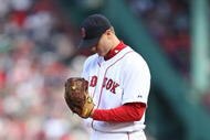 BOSTON - OCTOBER 11:  Pitcher Jonathan Papelbon #58 of the Boston Red Sox prepares to pitch against the Los Angeles Angels of Anaheim in the eighth inning of Game Three of the ALDS during the 2009 MLB Playoffs at Fenway Park on October 11, 2009 in Boston, Massachusetts. (Photo by Elsa/Getty Images)