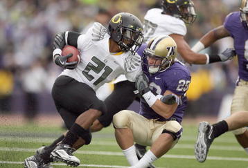 SEATTLE - OCTOBER 24:  LaMichael James #21 of the Oregon Ducks carries the ball against Nate Fellner #29 of the Washington Huskies on October 24, 2009 at Husky Stadium in Seattle, Washington. The Ducks defeated the Huskies 43-19. (Photo by Otto Greule Jr/Getty Images)