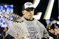 NEW YORK - NOVEMBER 04:  Manager Joe Girardi #27 of the New York Yankees celebrate after their 7-3 win against the Philadelphia Phillies in Game Six of the 2009 MLB World Series at Yankee Stadium on November 4, 2009 in the Bronx borough of New York City.  (Photo by Pool/Getty Images)