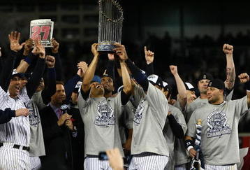 NEW YORK - NOVEMBER 04:  Mariano Rivera #42 of the New York Yankees holds up the trophy as he celebrates with his teammates after their 7-3 win against the Philadelphia Phillies in Game Six of the 2009 MLB World Series at Yankee Stadium on November 4, 2009 in the Bronx borough of New York City.  (Photo by Chris McGrath/Getty Images)