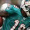 EAST RUTHERFORD, NJ - NOVEMBER 01: Ted Ginn #19 of the Miami Dolphins returns a kick off during a game against the New York Jets at Giants Stadium on November 1, 2009 in East Rutherford, New Jersey. (Photo by Chris Trotman/Getty Images)