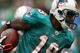 EAST RUTHERFORD, NJ - NOVEMBER 01:  Ted Ginn #19 of the Miami Dolphins returns a kick off during a game against the New York Jets at Giants Stadium on November 1, 2009 in East Rutherford, New Jersey.  (Photo by Chris Trotman/Getty Images)