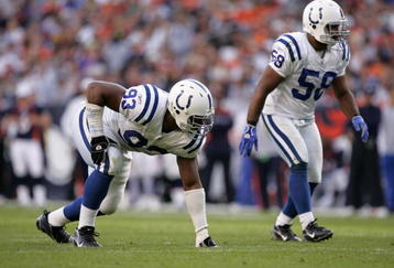 DENVER - OCTOBER 29:  Linebacker Gary Brackett #58 and defensive end Dwight Freeney #93 of the Indianapolis Colts wait for the snap during the game against the Denver Broncos on October 29, 2006 at Invesco Field at Mile High in Denver, Colorado.  The Colts won 34-31.  (Photo by Brian Bahr/Getty Images)