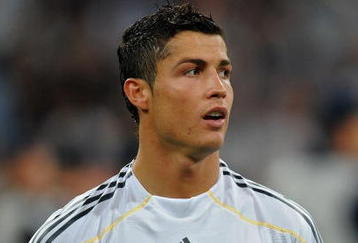 MADRID, SPAIN - SEPTEMBER 30:  Cristiano Ronaldo of Real Madrid looks on prior to the Champions League group C match between Real Madrid and Marseille at the Estadio Santiago Bernabeu on September 30, 2009 in Madrid, Spain. Real Madrid won the match 3-0.  (Photo by Jasper Juinen/Getty Images)